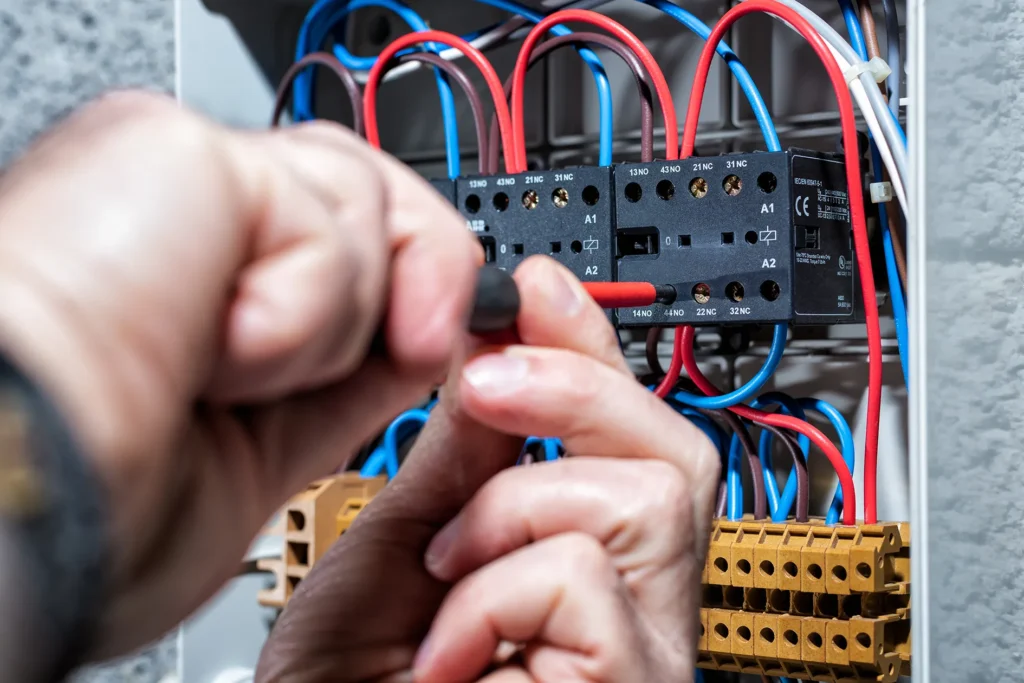Electrician Installing Relay